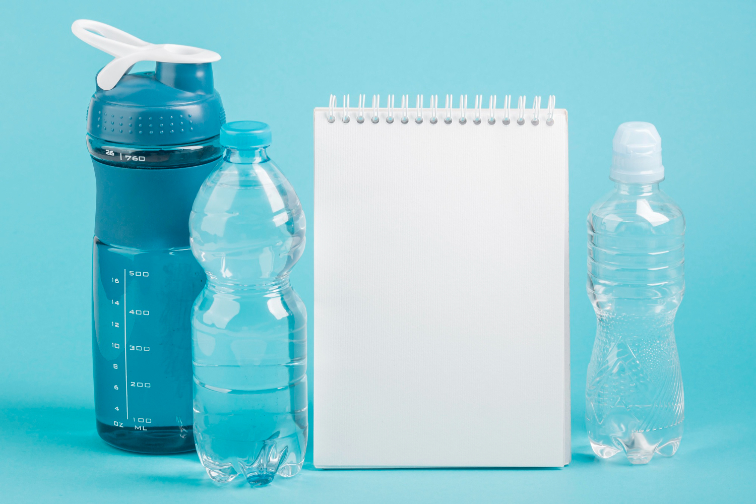 fitness-bottle-water-copy-space-notepad