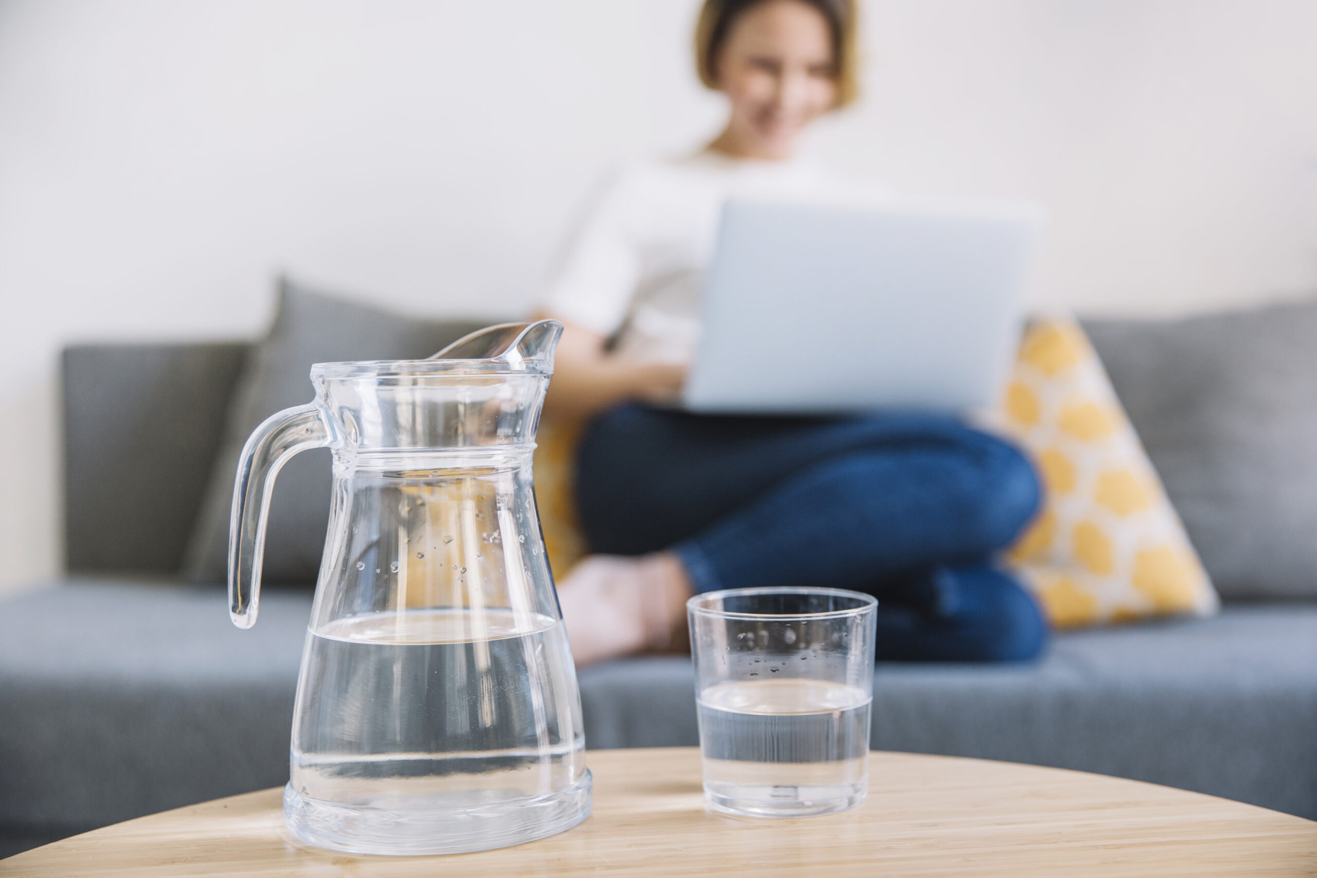 jug-glass-water-near-woman